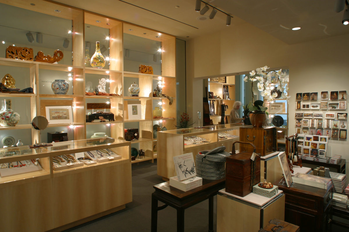 View of the museum boutique with books, jewelry, artwork and other items on display.
